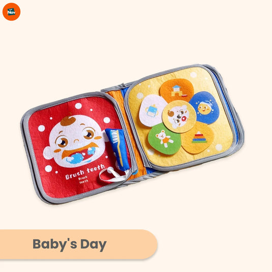 Baby touching colorful cloth book