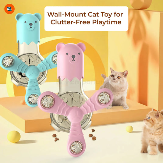 Cat playing with feeder