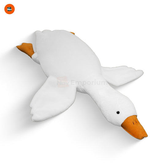 Decorative white goose plush pillow on bed