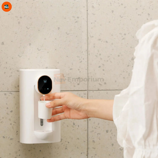 Lifestyle shot using touchless mouthwash dispenser at home