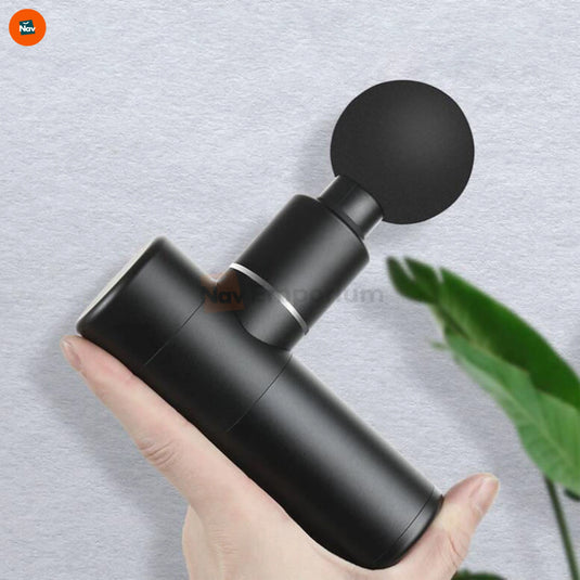 Lifestyle image uses portable massage gun outdoors