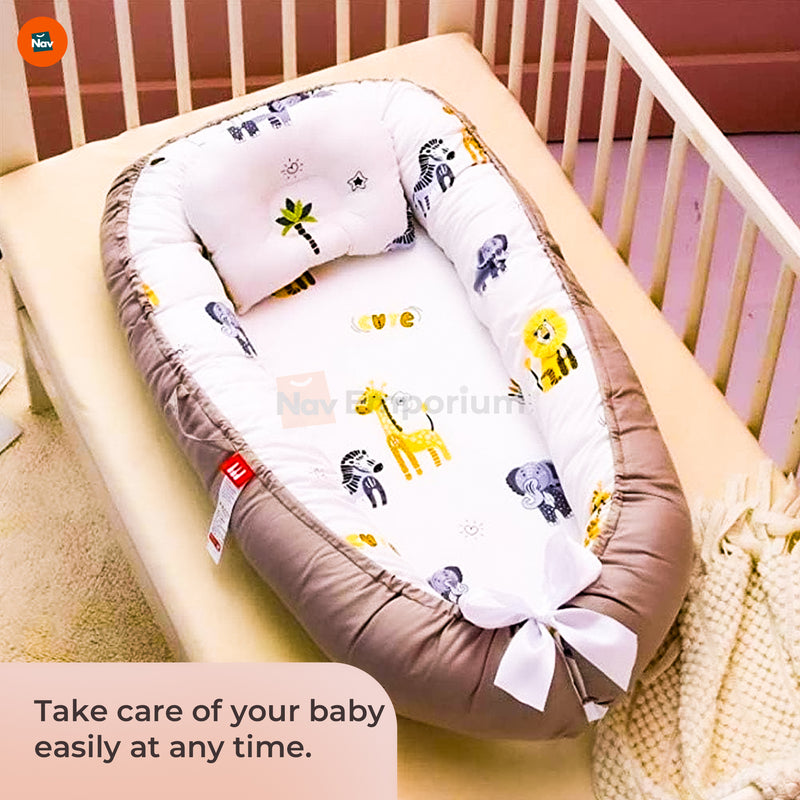 Parent with sleeping baby in BionicCot 