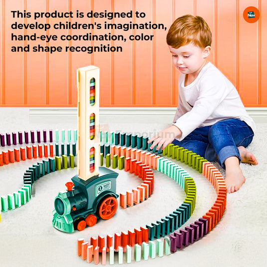 Child playing with domino train set 